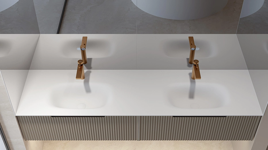 Double-basin sink paired with a brass basin faucet.
